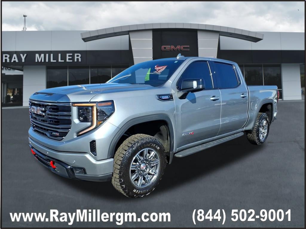 2024 GMC Sierra 1500 AT4 in Sterling Metallic — front three-quarter view